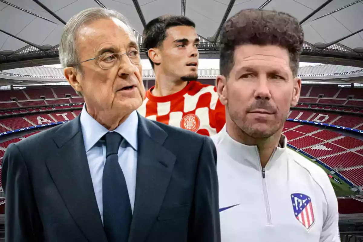 Three men in a soccer stadium, one in a suit, another in sports uniform, and the third in a red and white checkered jersey.