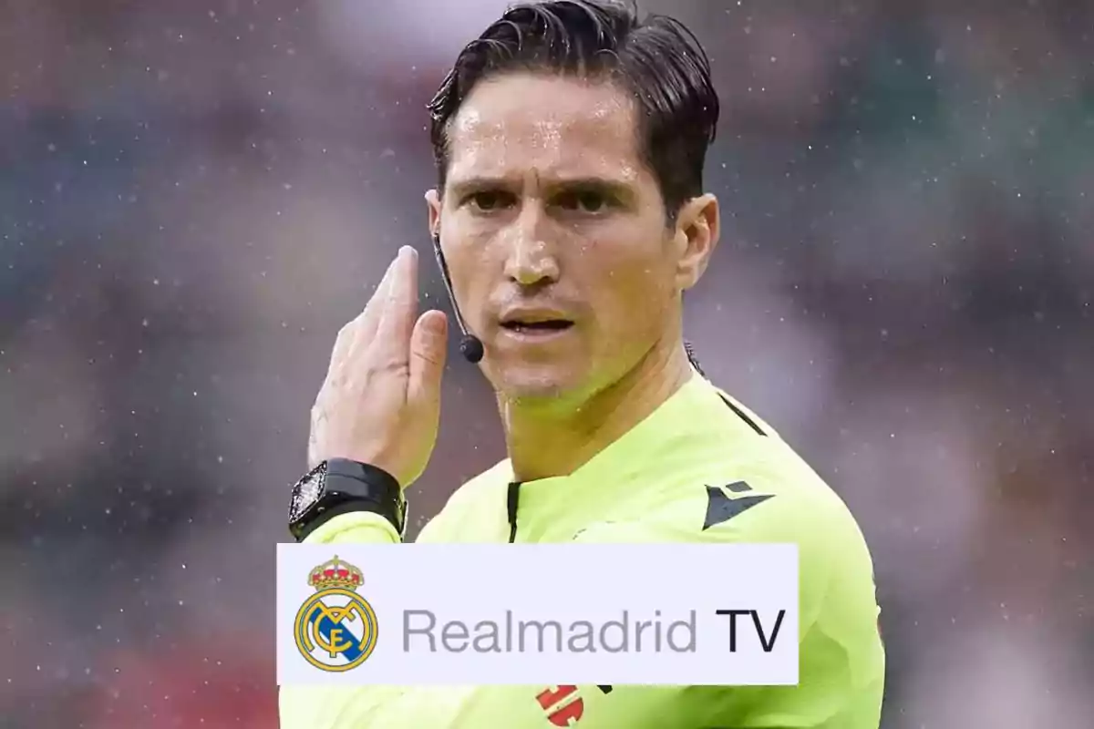 A soccer referee in a yellow uniform with a microphone in his ear on a playing field with the Real Madrid TV logo at the bottom.