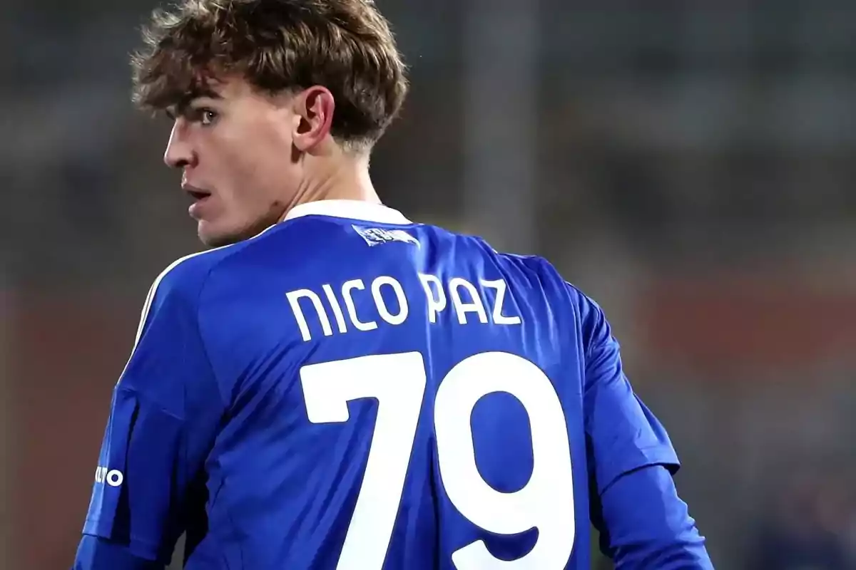 A player with the number 79 on his blue jersey looks to the side during a match. A player with the number 79 on his blue jersey looks to the side during a match.