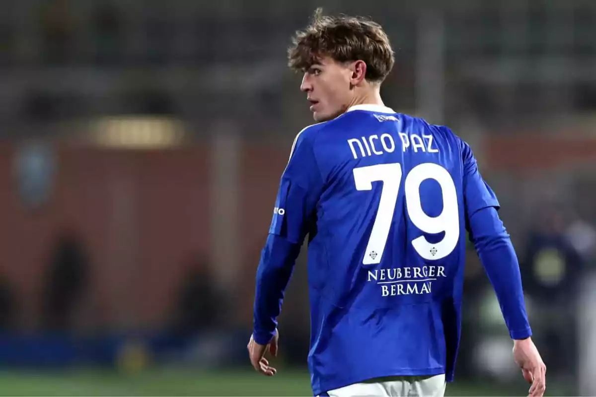 Soccer player wearing a blue jersey with the number 79 on the back during a match Soccer player wearing a blue jersey with the number 79 on the back during a match