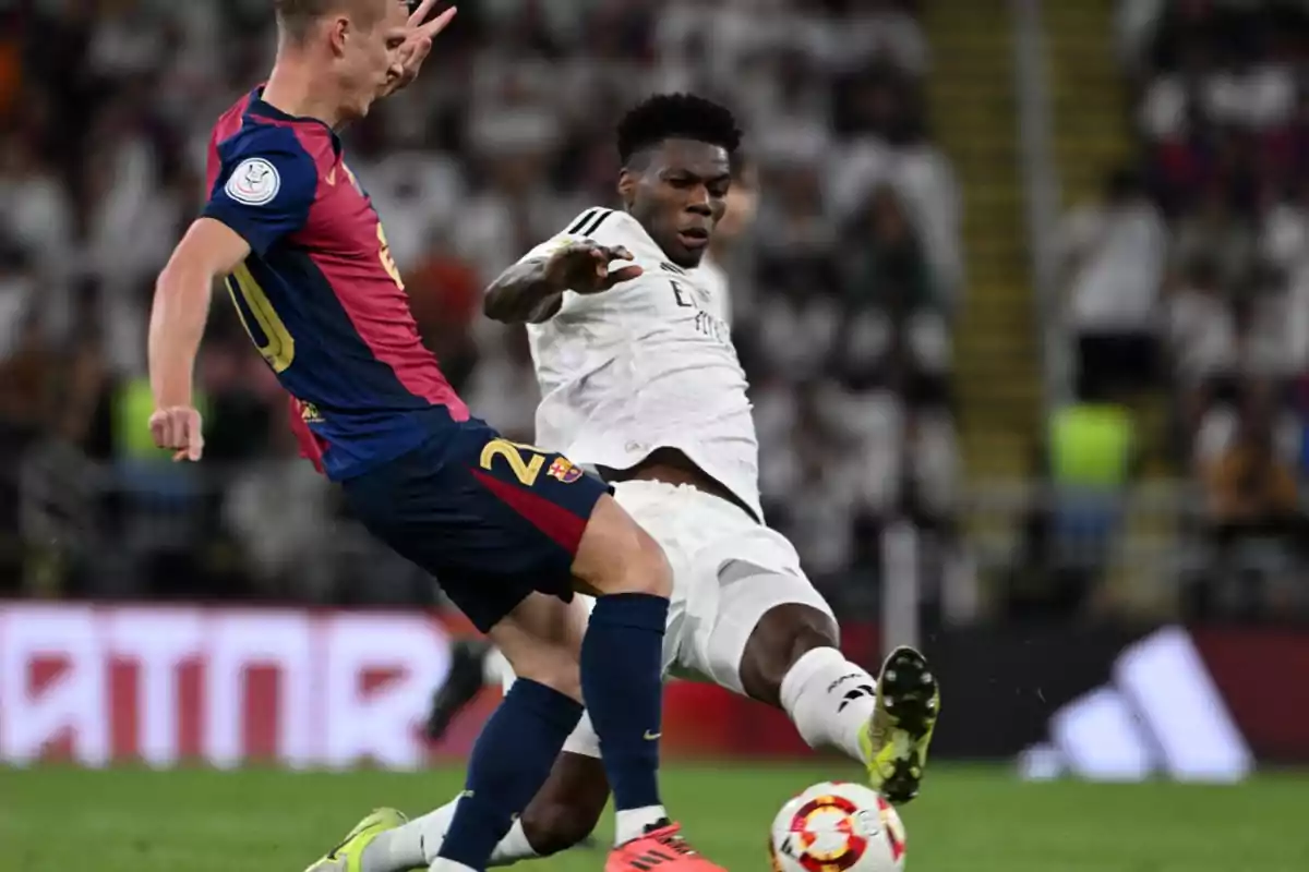 Two soccer players compete for the ball during a match. Two soccer players compete for the ball during a match.