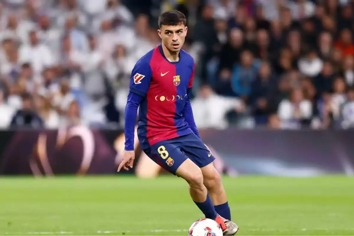 Soccer player in blue and red uniform on the field during a match. Soccer player in blue and red uniform on the field during a match.