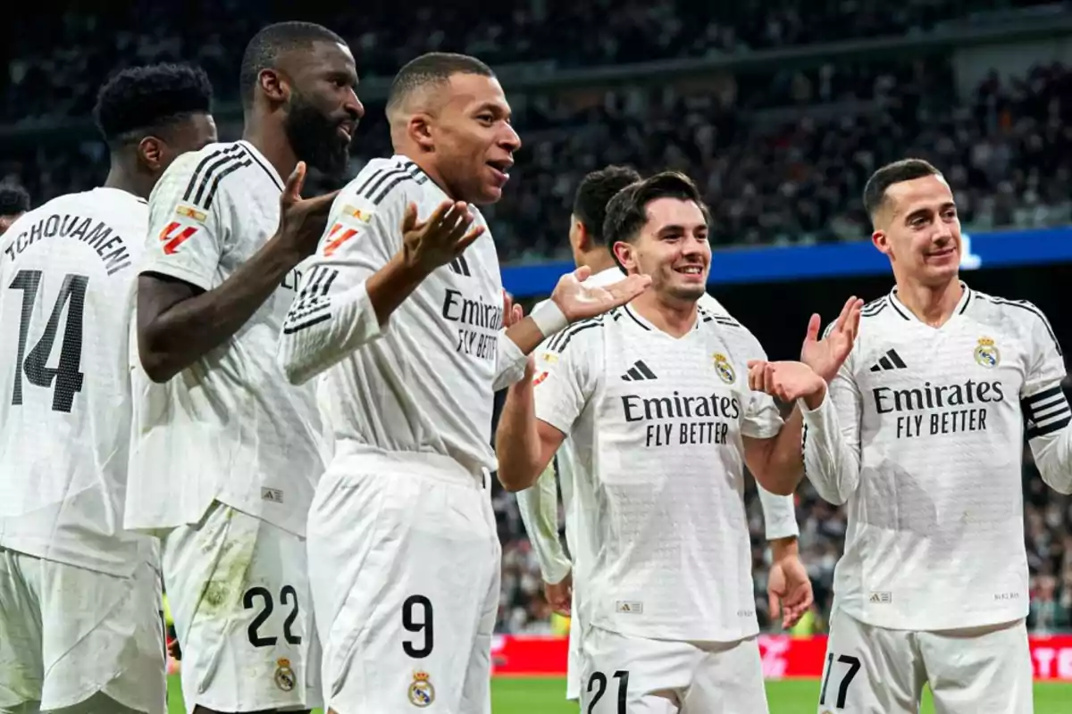 Real Madrid soccer players celebrating on the field with expressions of joy and camaraderie. Real Madrid soccer players celebrating on the field with expressions of joy and camaraderie.