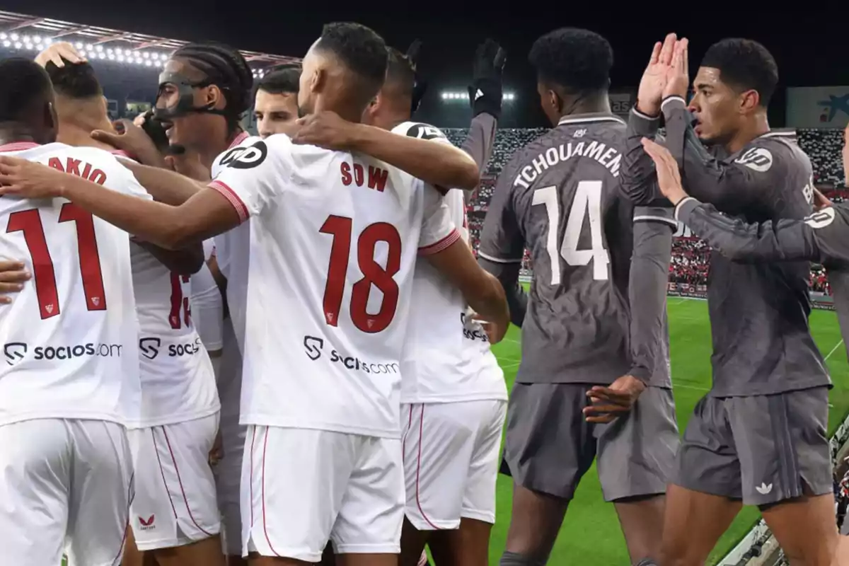 Soccer players from two different teams celebrate on the field during a night game.