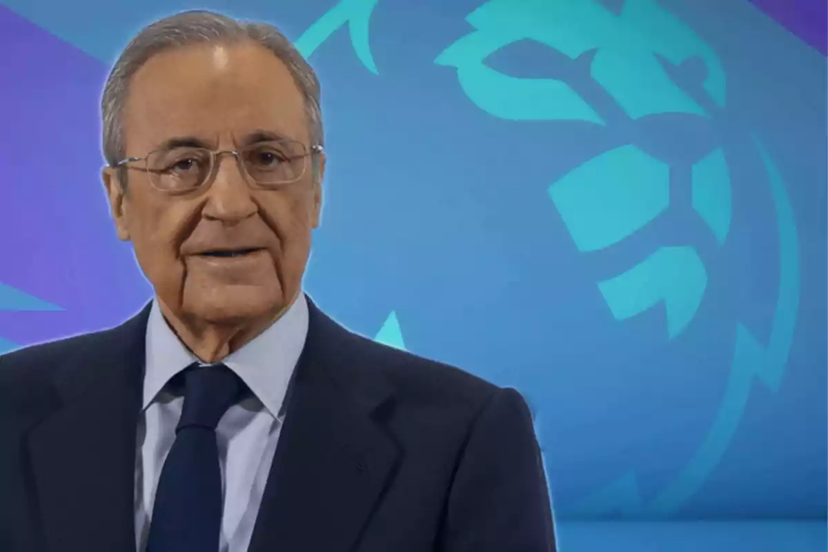 An older man wearing glasses and a dark suit stands in front of a blue background with an abstract design.