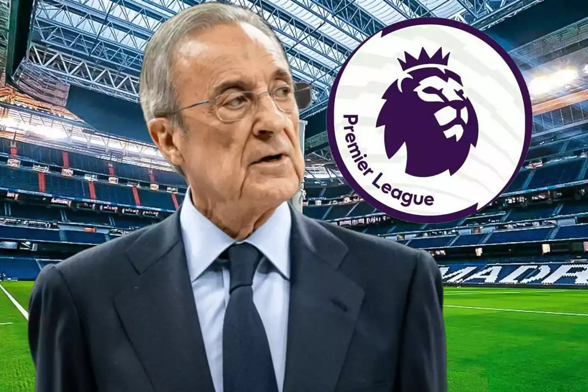 Man in suit in a soccer stadium with the Premier League logo in the background.