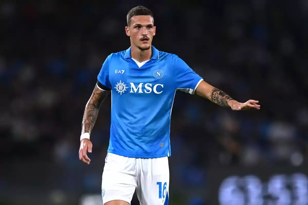 Soccer player in a blue Napoli uniform on the field. Soccer player in a blue Napoli uniform on the field.