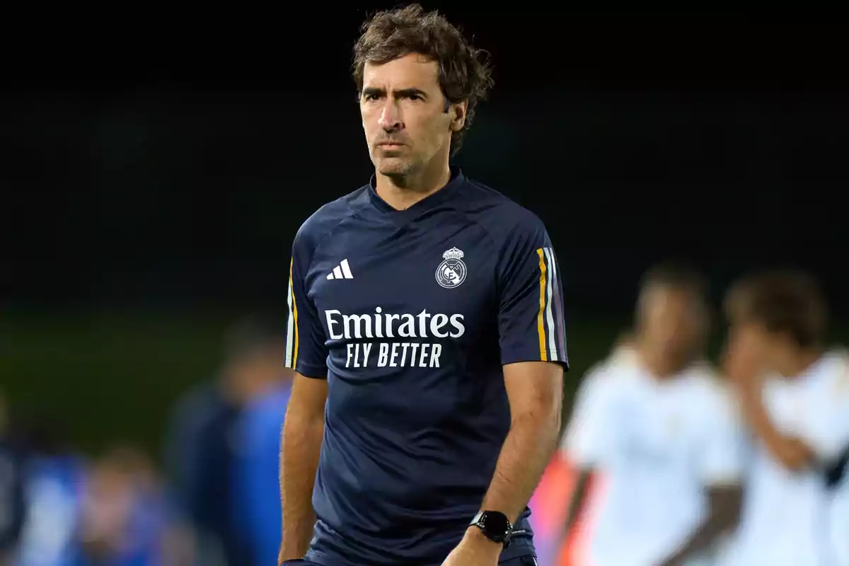 Man in a Real Madrid sports uniform on a soccer field. Man in a Real Madrid sports uniform on a soccer field.