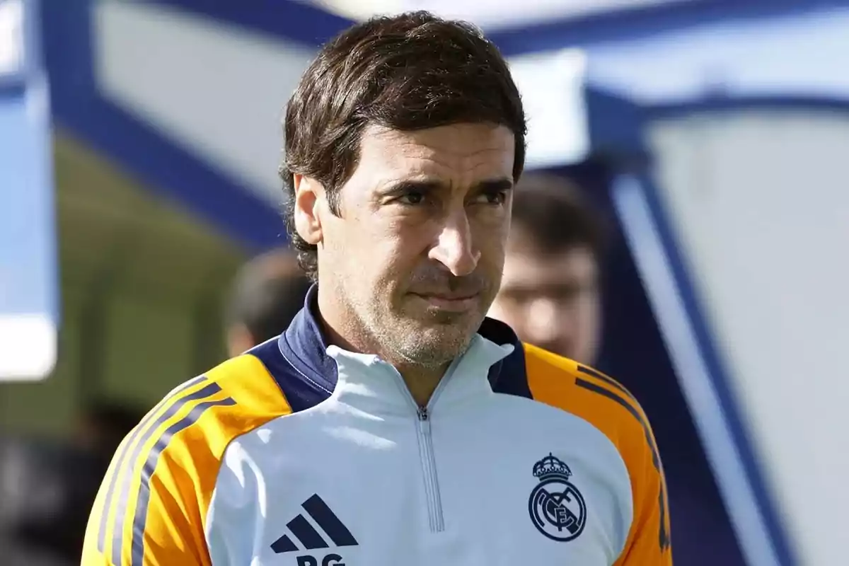 Man with a Real Madrid sports jacket in an outdoor setting. Man with a Real Madrid sports jacket in an outdoor setting.