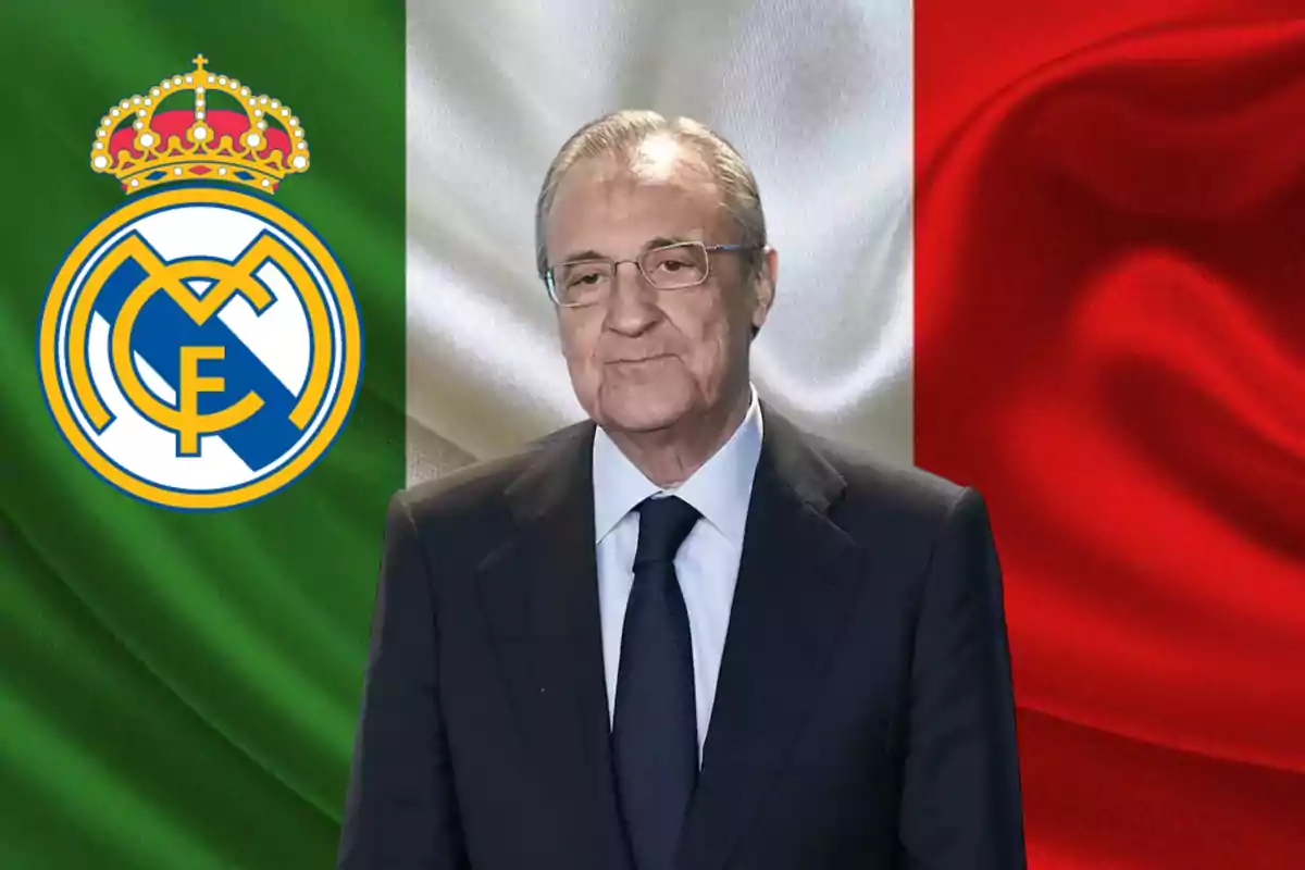 Un hombre con traje y corbata está frente a una bandera con los colores verde, blanco y rojo, junto al escudo del Real Madrid.