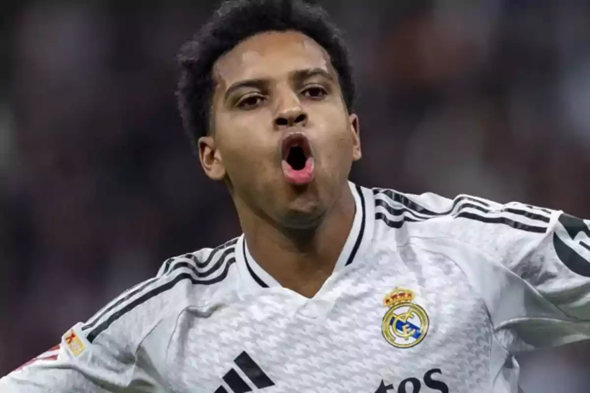 A player celebrating enthusiastically while wearing his team's white uniform. A player celebrating enthusiastically while wearing his team's white uniform.