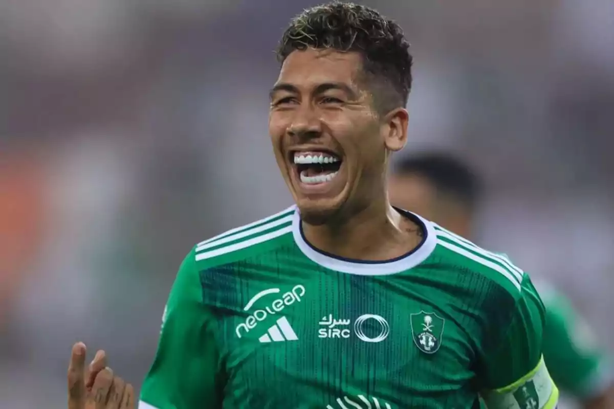 Soccer player in a green uniform celebrating on the field with a big smile Soccer player in a green uniform celebrating on the field with a big smile