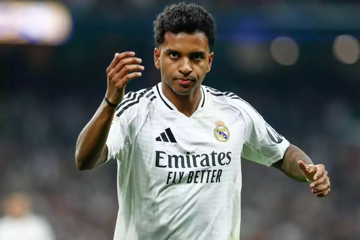 A player wearing the white Real Madrid jersey on the field. A player wearing the white Real Madrid jersey on the field.