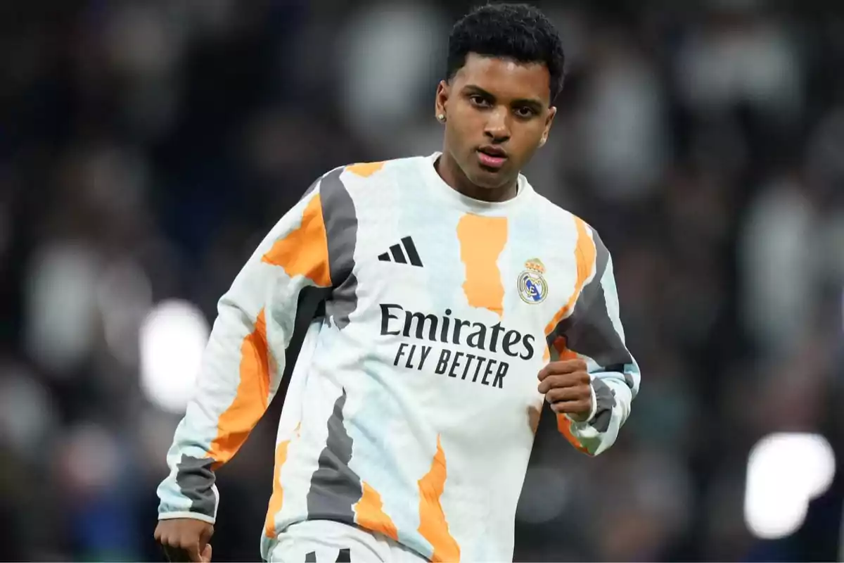 A player in Real Madrid training uniform on the field. A player in Real Madrid training uniform on the field.
