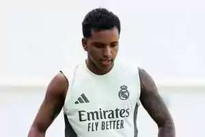 Soccer player wearing a Real Madrid training jersey on a sports field