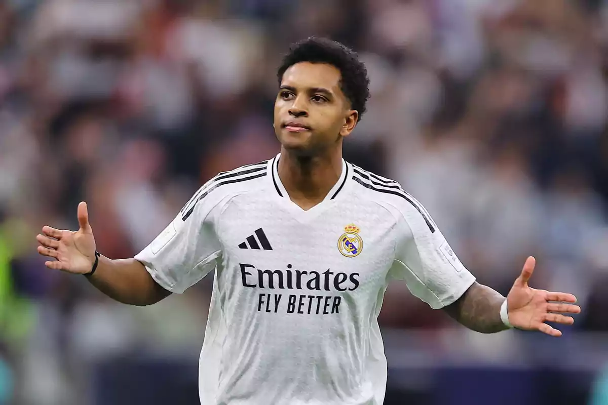Soccer player in a white Real Madrid uniform on the field. Soccer player in a white Real Madrid uniform on the field.