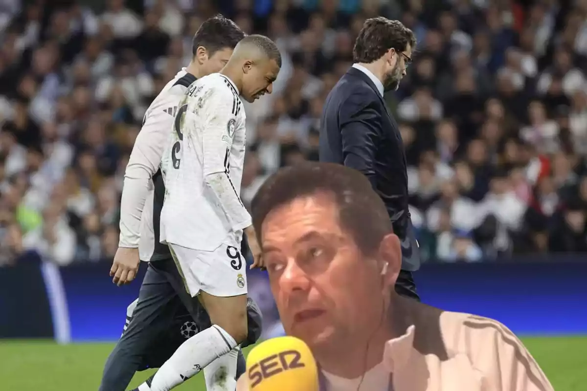 A player in a white uniform walks alongside other people in a stadium full of spectators, while in the foreground a man with headphones is speaking into a yellow microphone.