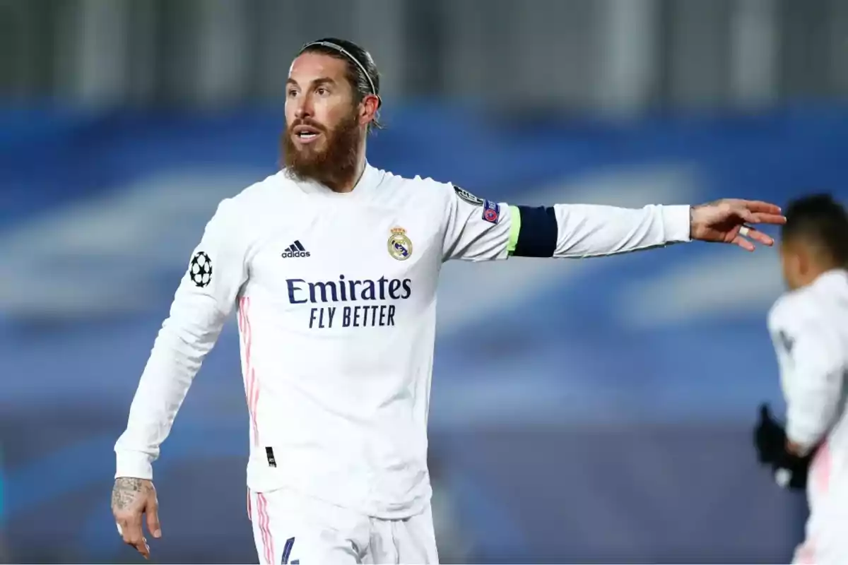 Soccer player in white uniform on the field during a match. Soccer player in white uniform on the field during a match.