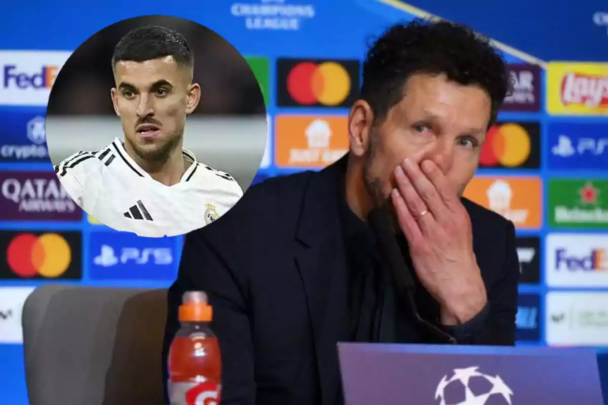 A man at a UEFA Champions League press conference with a player in a box.