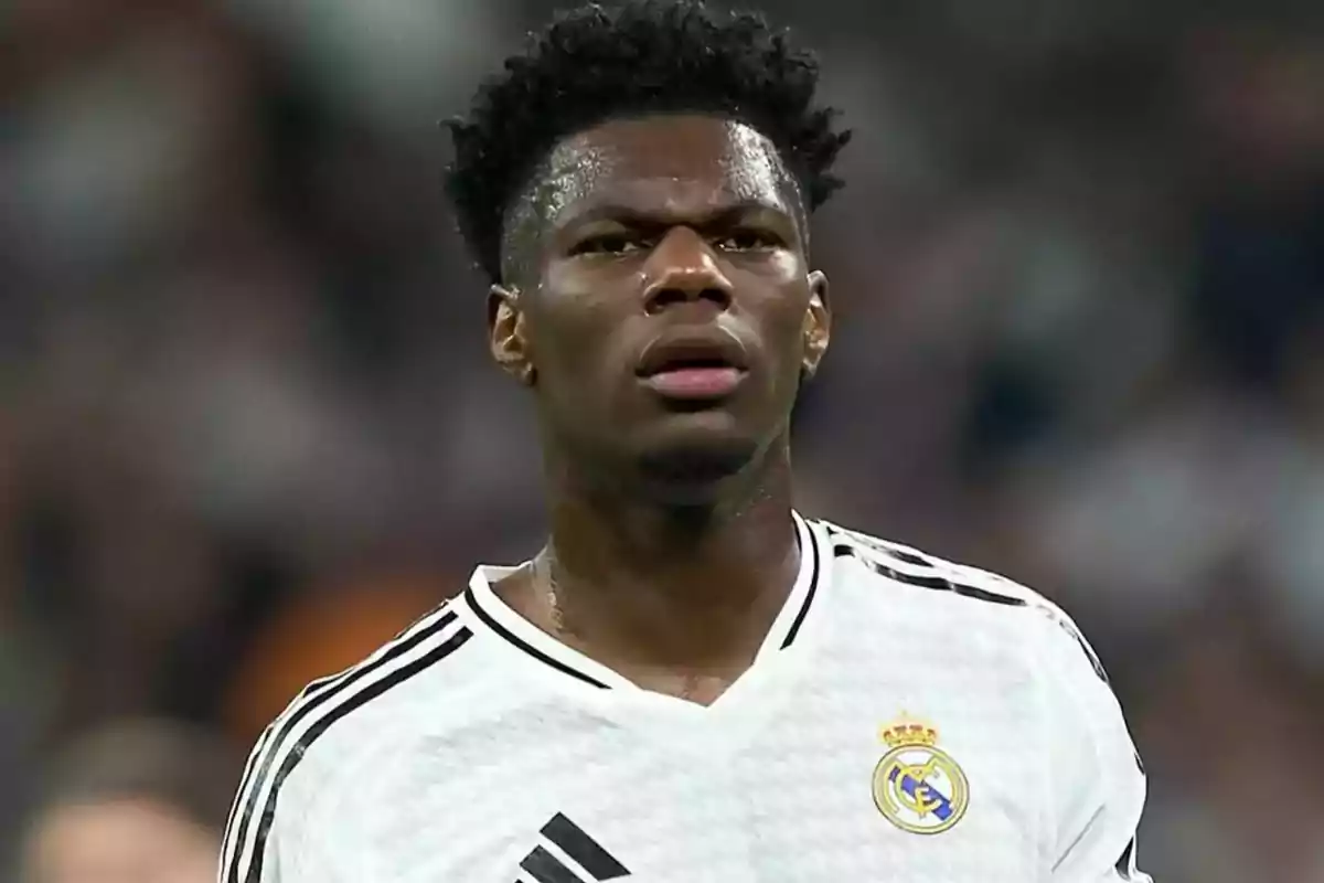 Soccer player wearing a white Real Madrid jersey during a match Soccer player wearing a white Real Madrid jersey during a match
