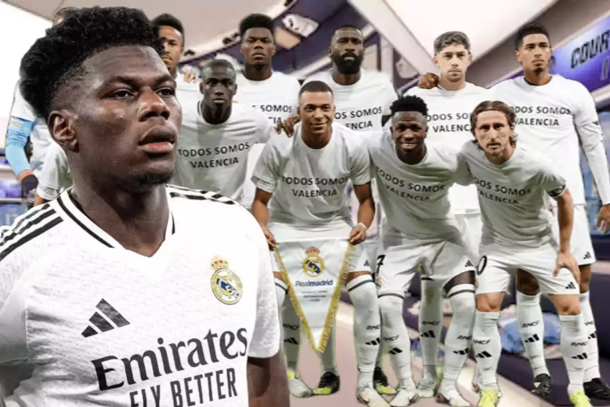 Football players wearing white T-jerseys reading "We are all Valencia" pose together in a stadium.