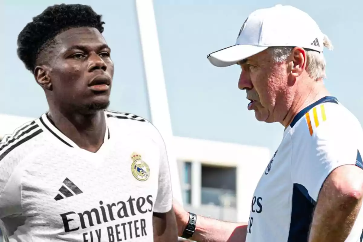 Un jugador de fútbol con uniforme blanco del Real Madrid está junto a un entrenador que lleva una gorra blanca.