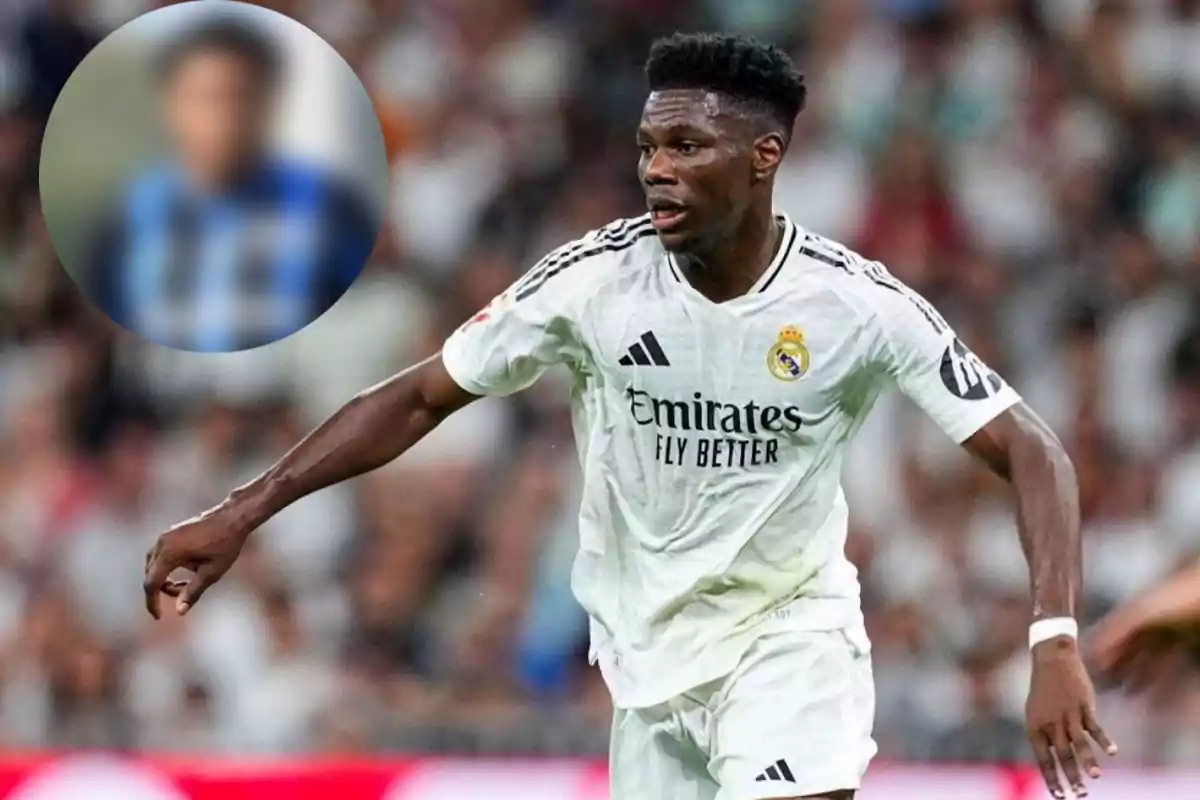 Real Madrid soccer player in action during a match with a blurred crowd background.