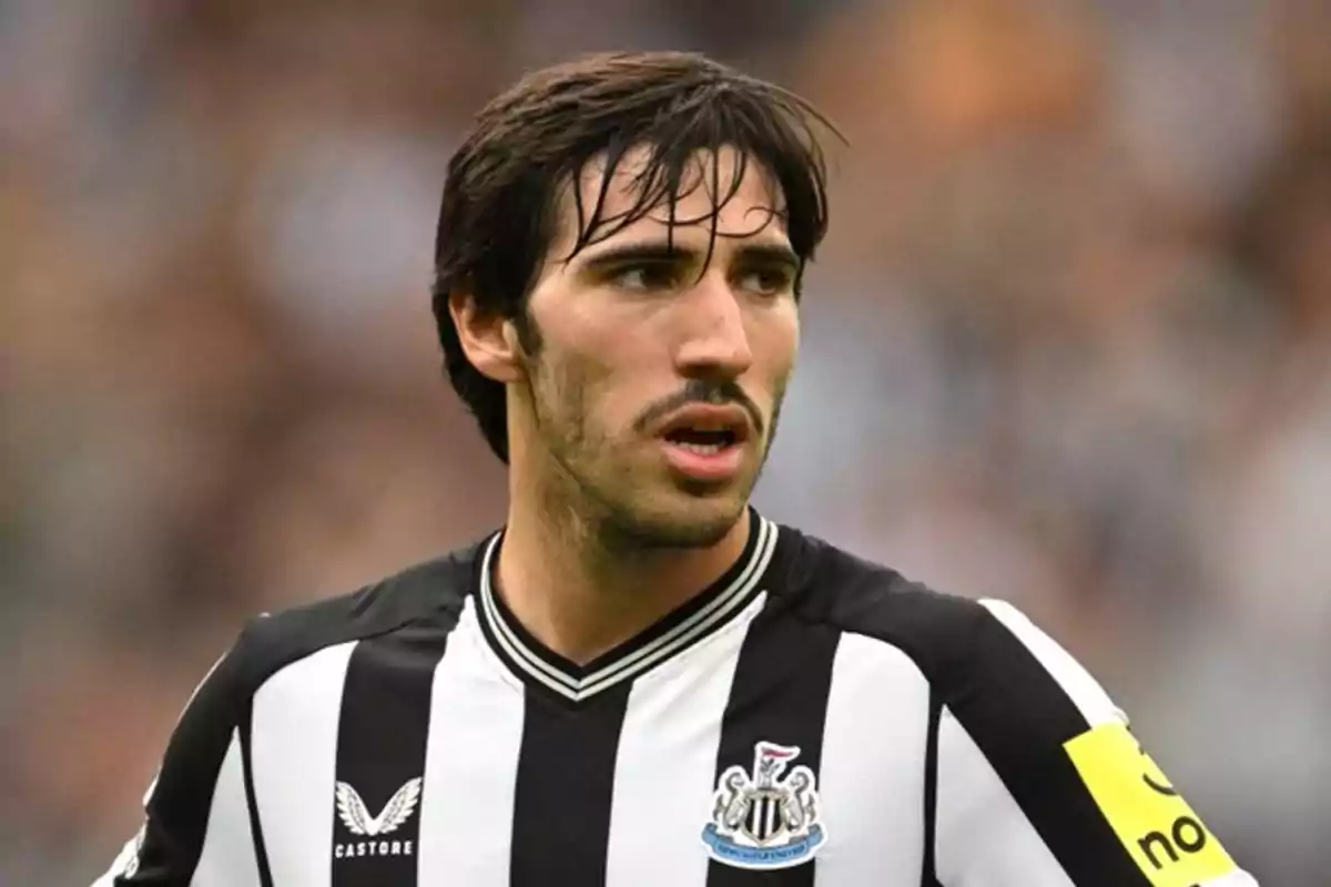 A player in a black and white uniform on the field. A player in a black and white uniform on the field.