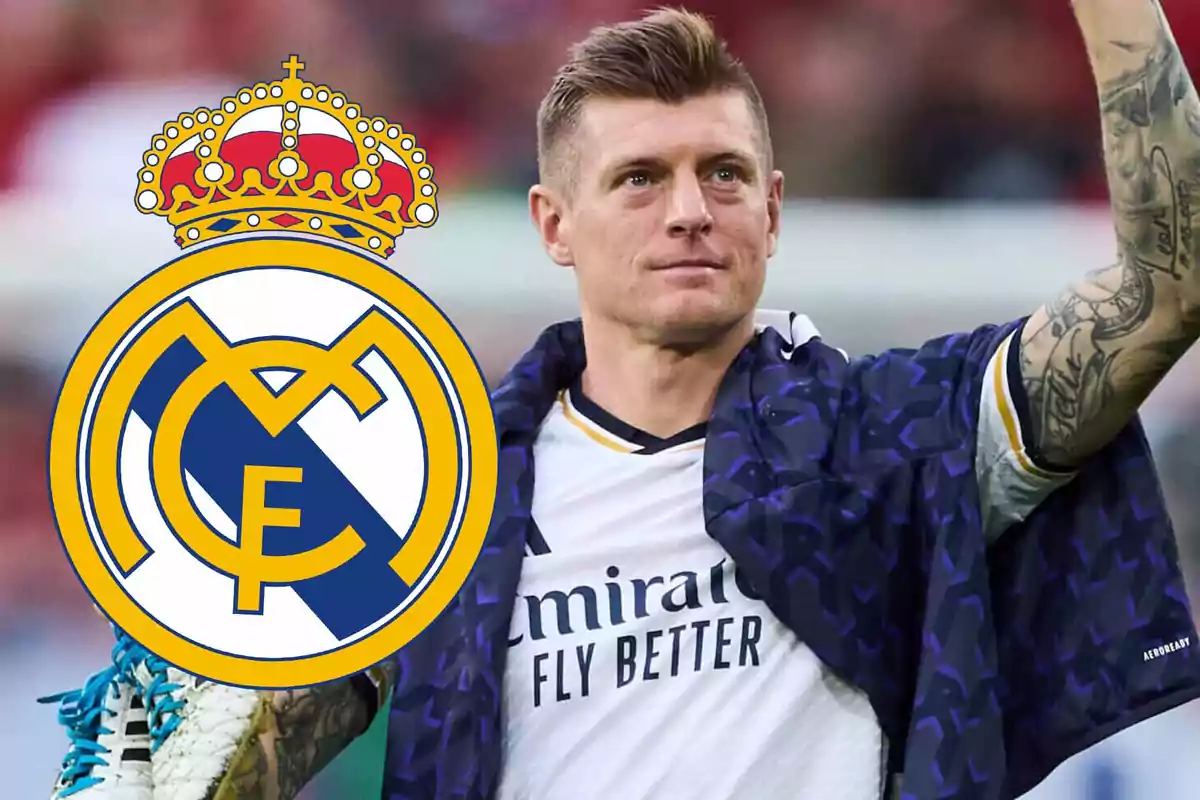 Soccer player in a Real Madrid uniform raising his arm with the club’s crest in the foreground