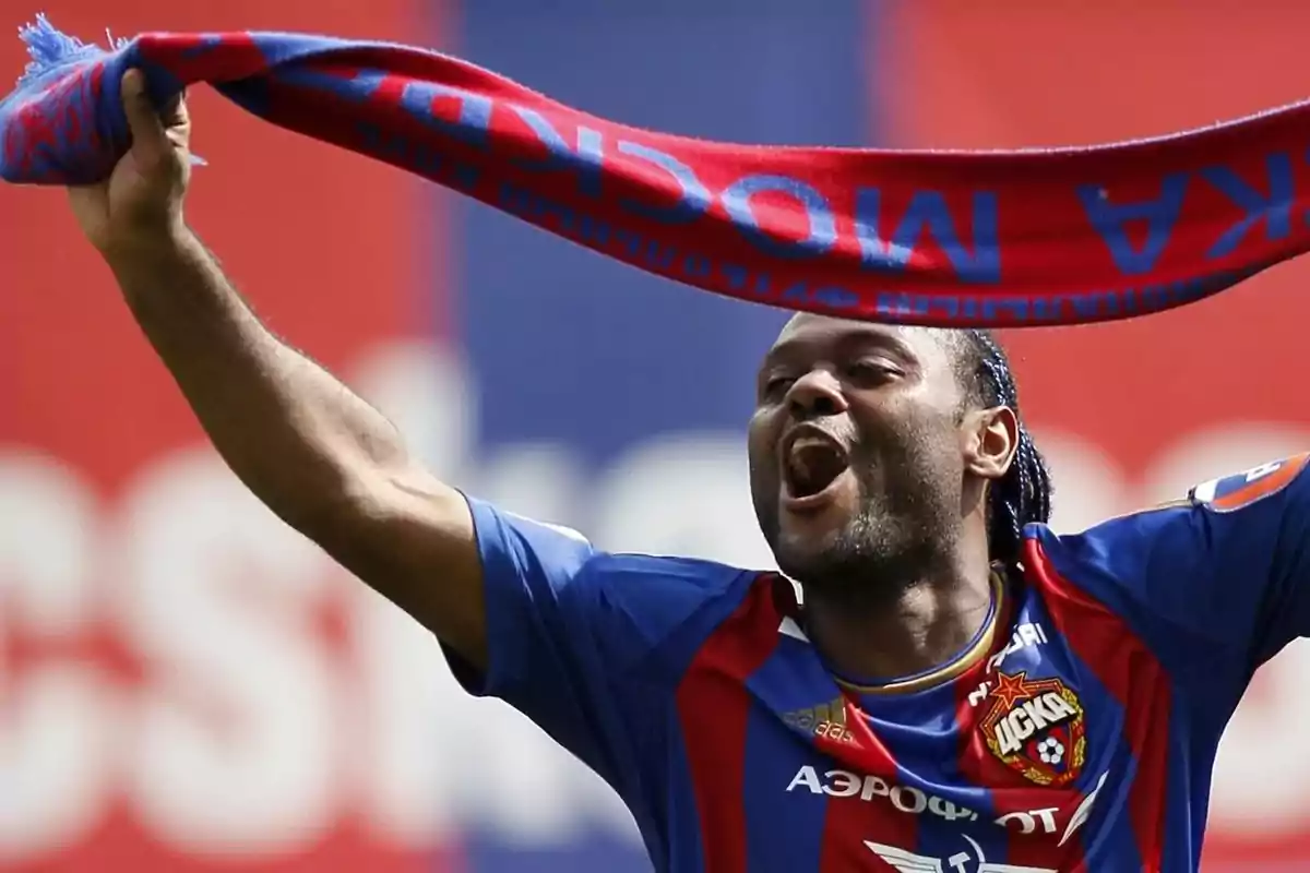 Person celebrating with a CSKA Moscow scarf at a stadium.