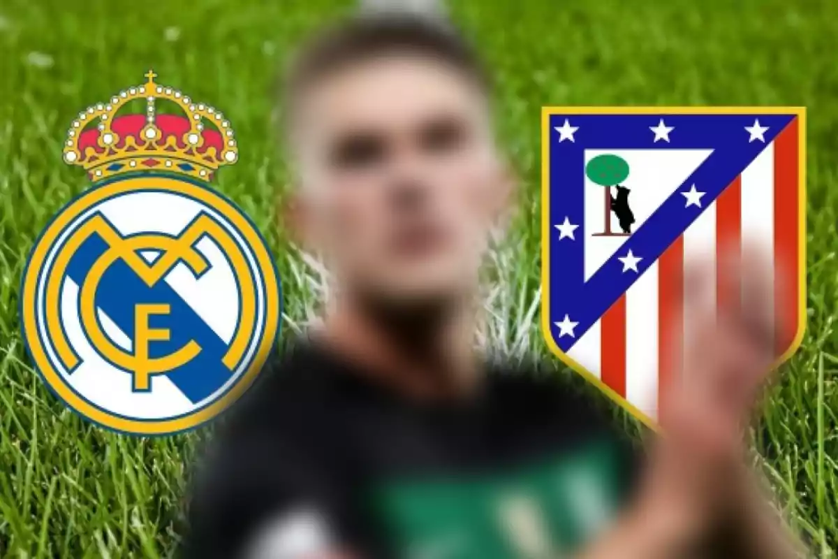 An out-of-focus player in the center with the Real Madrid and Atlético de Madrid crests in the background on the grass.