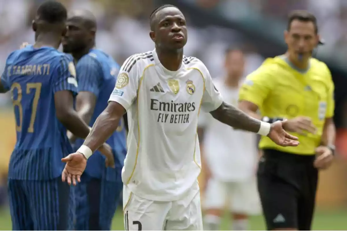 Real Madrid player with arms outstretched in protest during a match while a referee and opposing players are in the background Real Madrid player with arms outstretched in protest during a match while a referee and opposing players are in the background