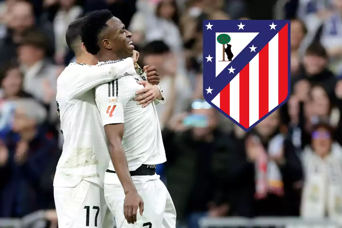 Two players celebrate on the field while the Atlético de Madrid crest appears overlaid on the right.