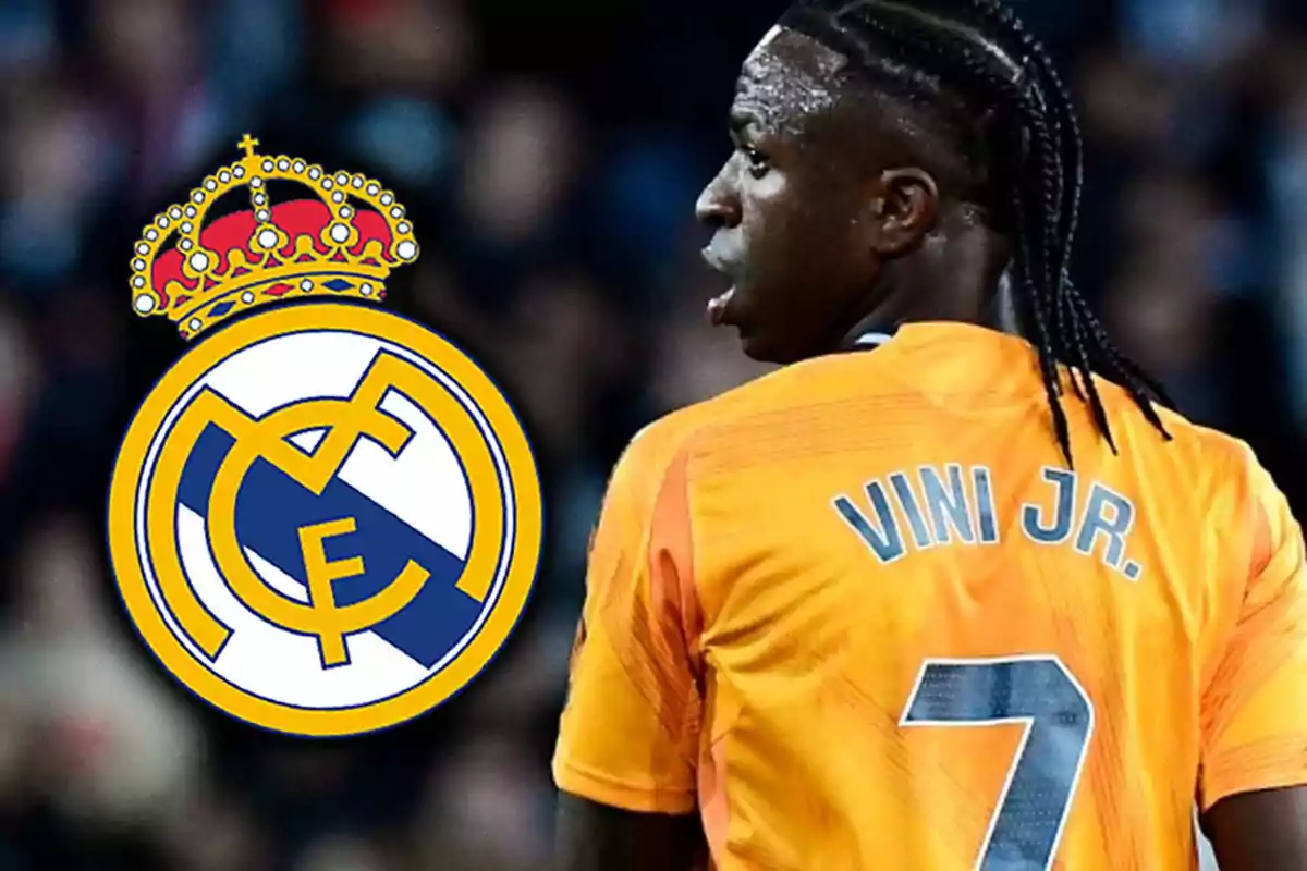 Football player with orange number 7 jersey and the Real Madrid logo next to him.