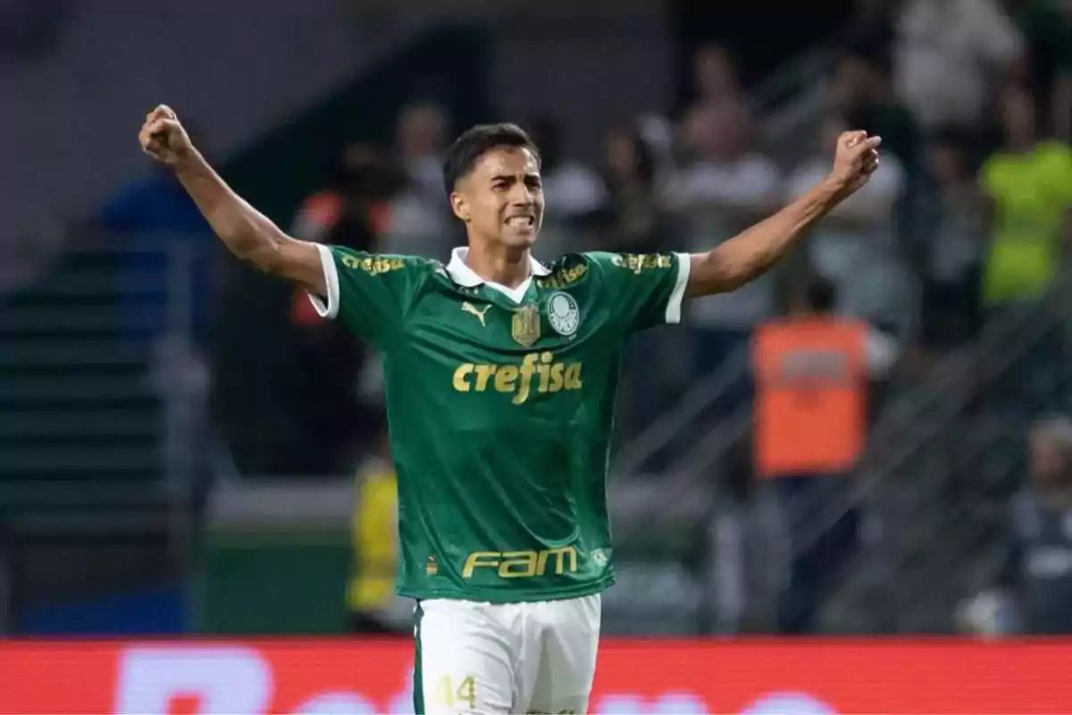 Football player in green uniform celebrating on the field.