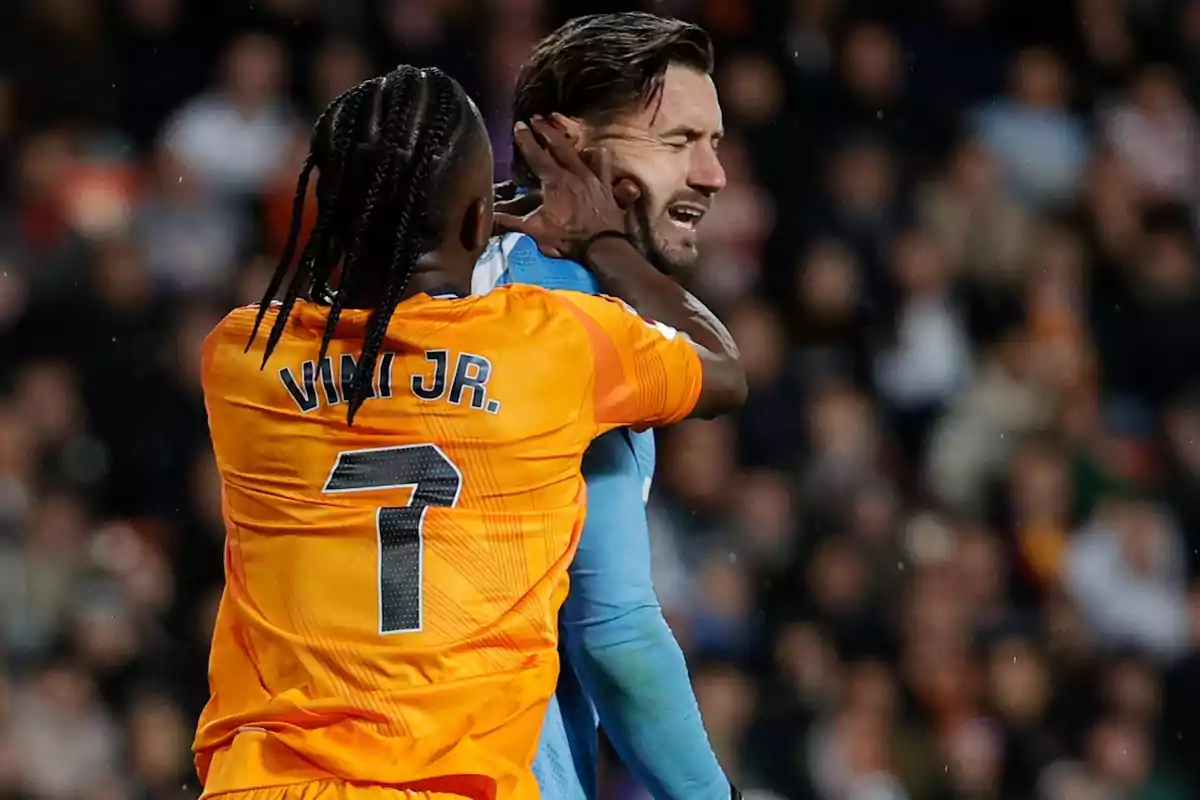 Two soccer players in a moment of physical contact during a match. Two soccer players in a moment of physical contact during a match.