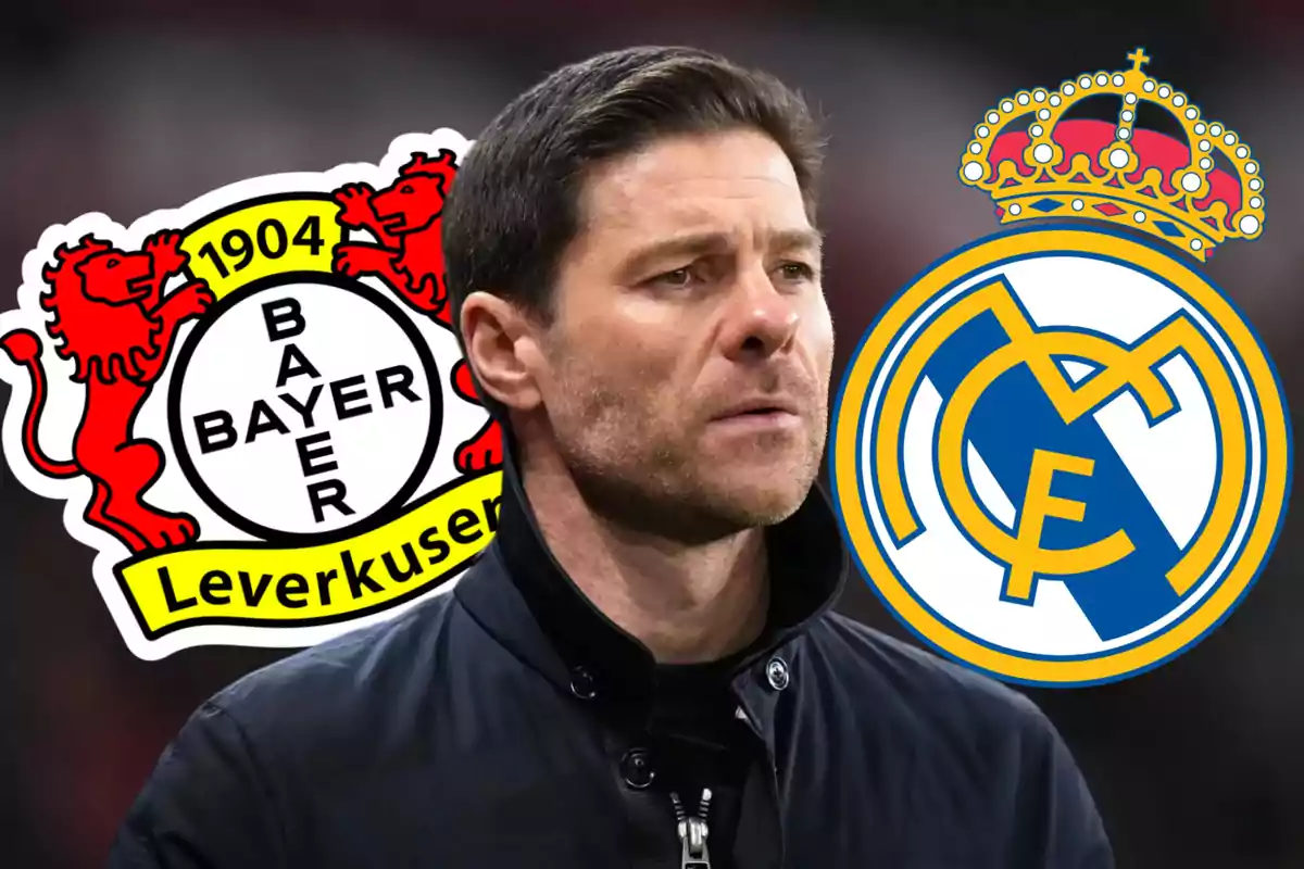 Un hombre con chaqueta oscura está en el centro de la imagen, con los logotipos del Bayer Leverkusen a la izquierda y del Real Madrid a la derecha.