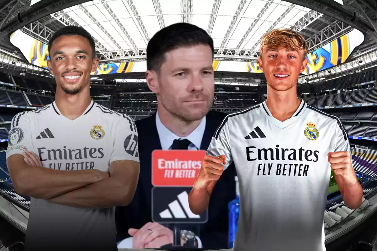 Three people at Santiago Bernabéu Stadium, two of them wearing Real Madrid jerseys and one in the center in a suit in front of a press conference microphone