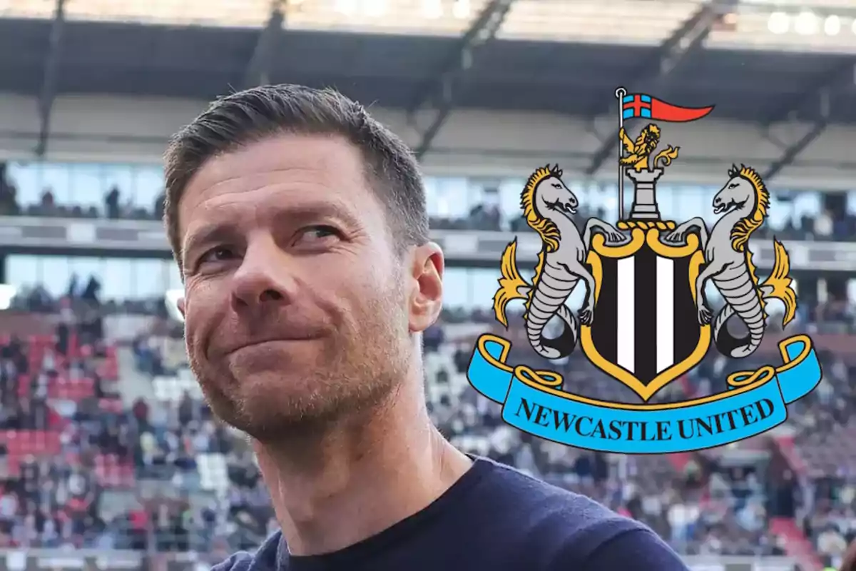 A man in a stadium with the Newcastle United crest.