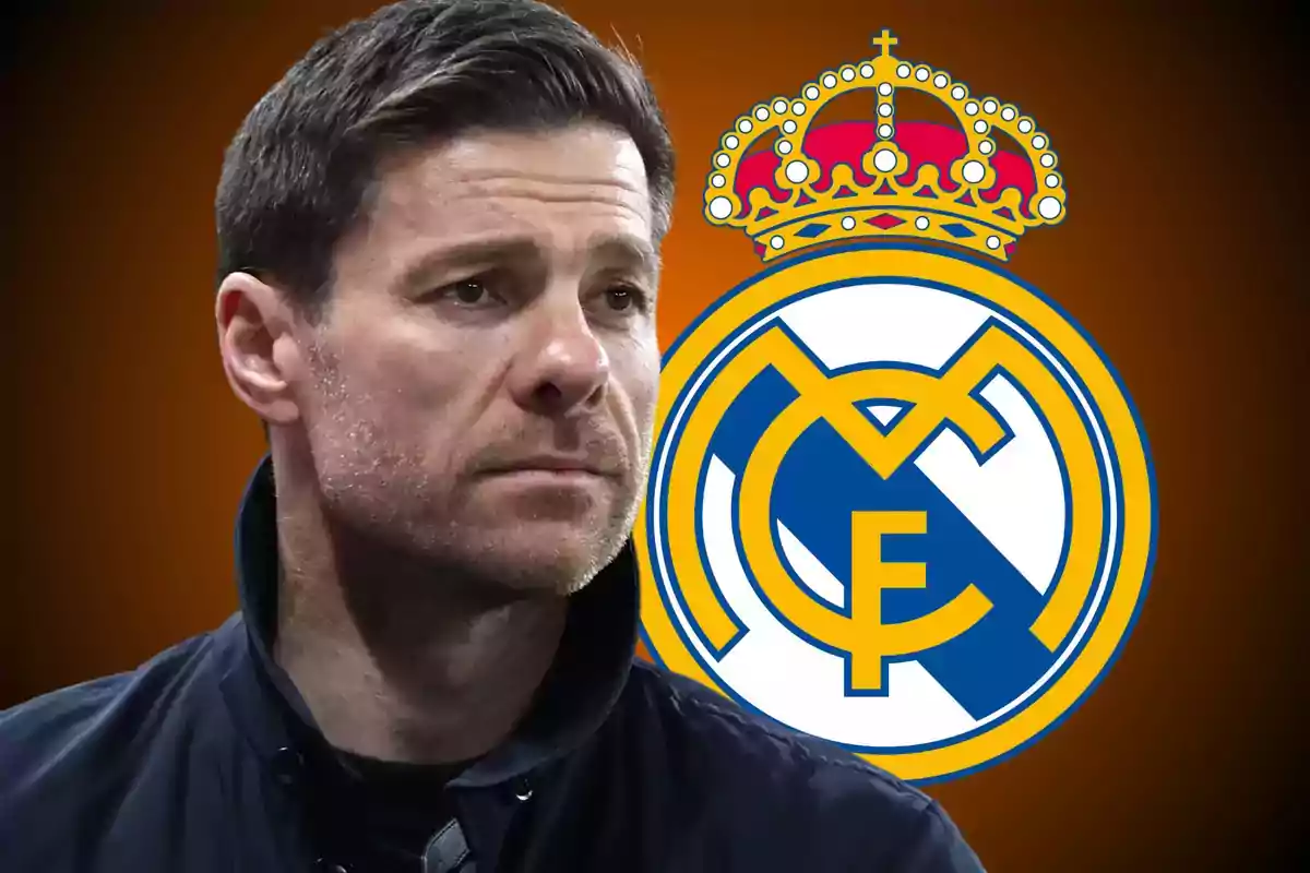 Short-haired man with a light beard and a serious expression in front of the Real Madrid crest against a dark orange background