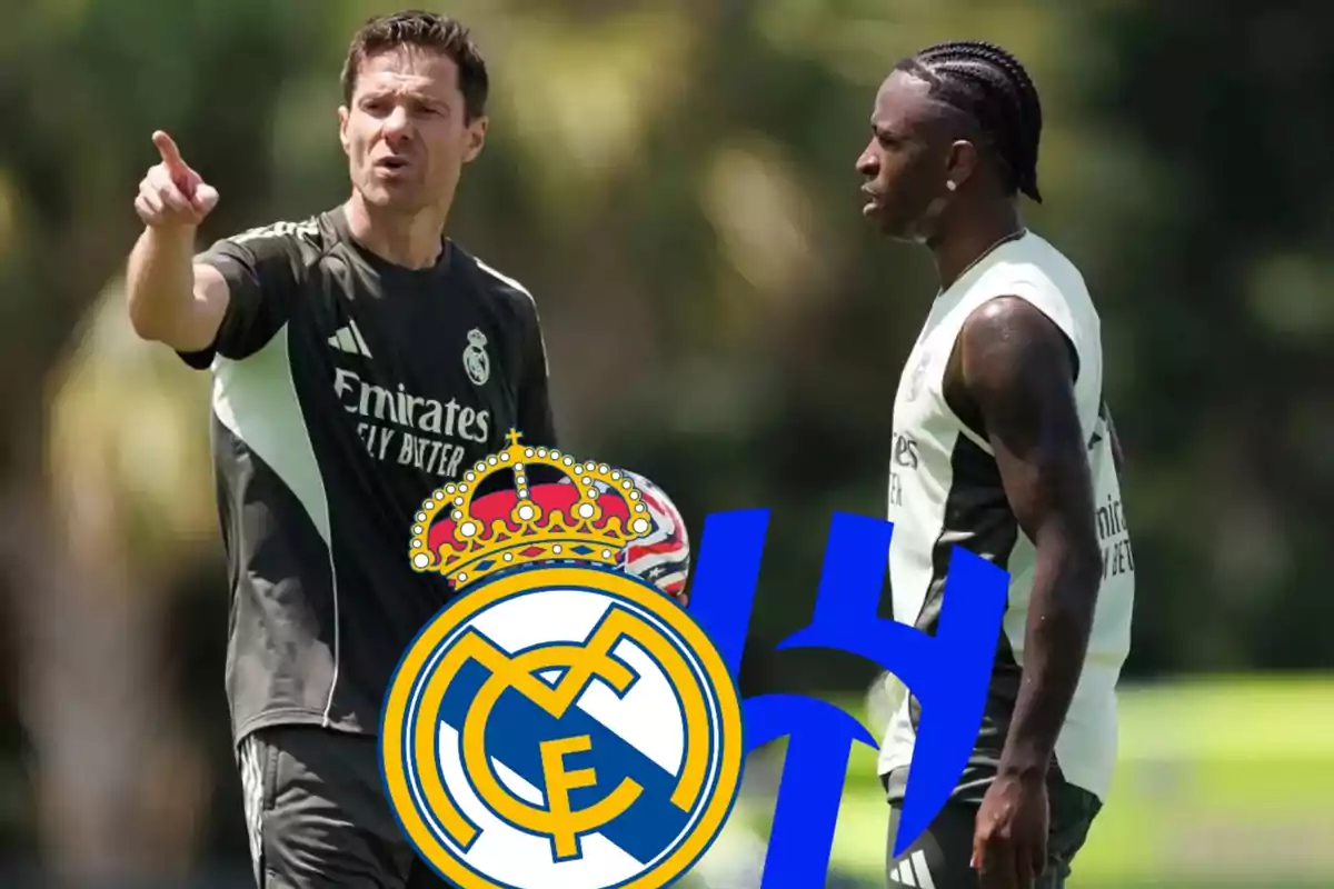 Entrenador y jugador del Real Madrid conversando en un campo de entrenamiento con los logos del club y de la Champions League en primer plano