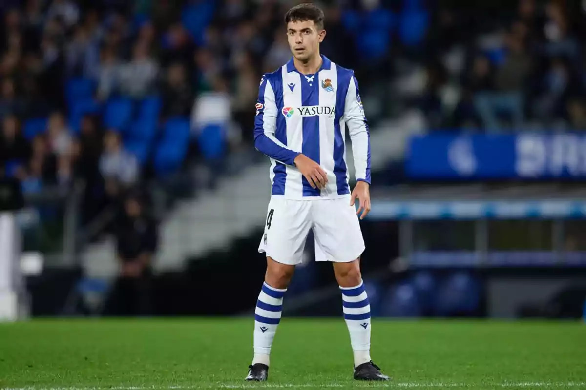 Soccer player in blue and white striped uniform on the field during a match. Soccer player in blue and white striped uniform on the field during a match.